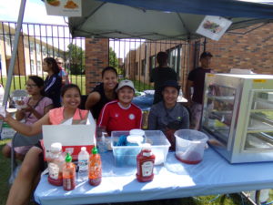 Volunteers and staff serving food at food tent