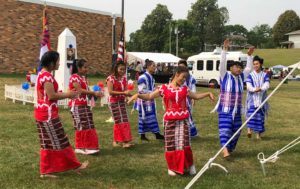A group of 8 KOM youth perform a don dance at Karen Martyr's Day